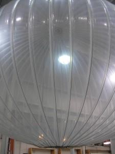 a large pumpkin-shaped, translucent balloon