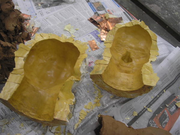 two empty halves of the mold, clean, shiny with shellac