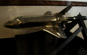 shiny silver model of a space shuttle